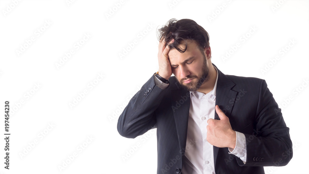 Close up portrait of a young bearded man suffering from a strong headache isolated over white background Close up portrait of a young bearded man suffering from a strong headache isolated over white background