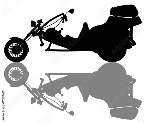 The black silhouette of a heavy motor tricycle photo