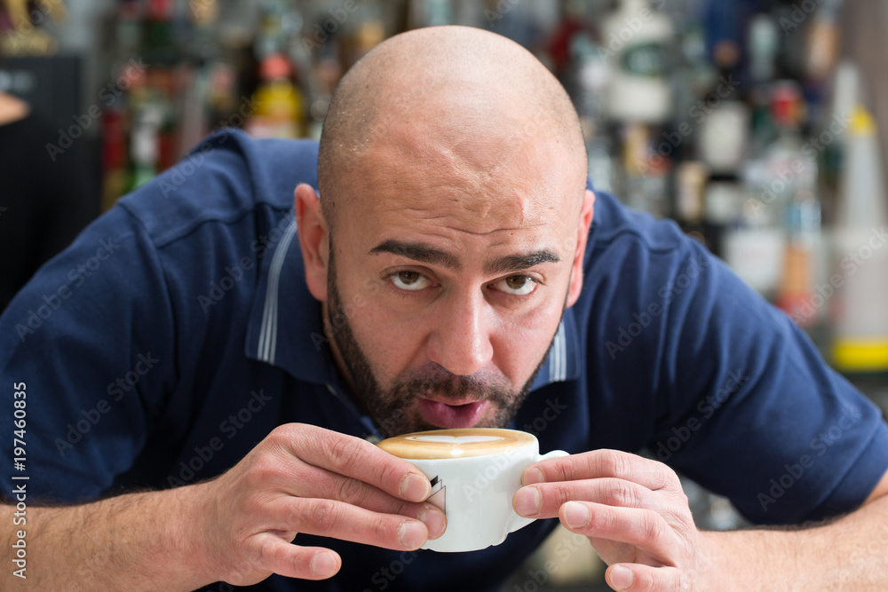 bartender having a cappuccino bartender having a cappuccino