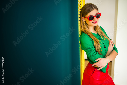 Foto Attractive stylish girl on a yellow background