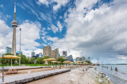 Toronto promenade with beach umbrellas and gulls, Toronto, Ontario, Canada.
