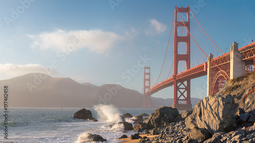 Golden Gate Bridge at sunset seen from the Marshall's Beach in San Francisco, California. 