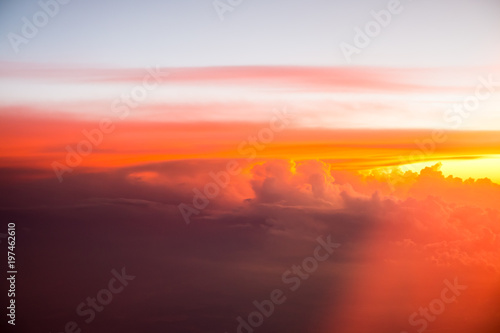 Red clouds on the sky. Top view from the plane