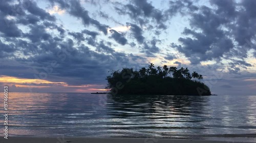 Landscape of Taakoka islet at sunrise in Muri lagoon Rarotonga Cook Islands photo