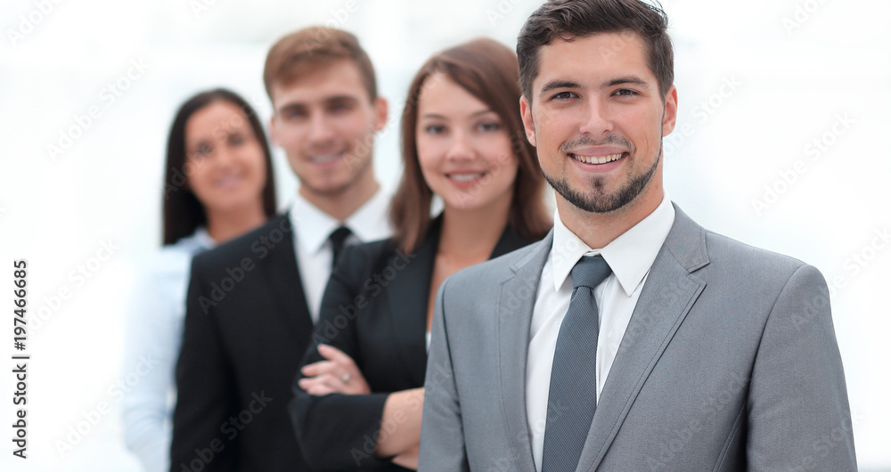 leader and the business team standing one behind the other. leader and the business team standing one behind the other.