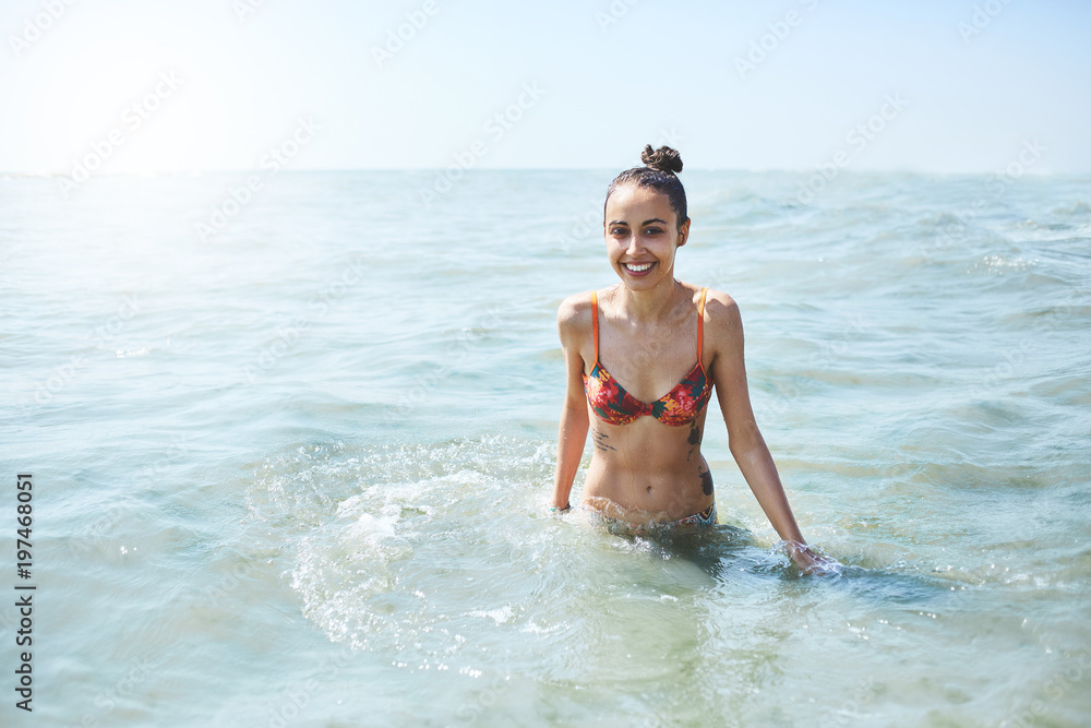 happy smiling woman is swimming in the sea happy smiling woman is swimming in the sea