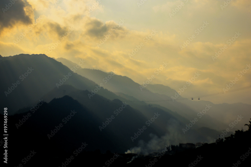 Impressive sun rise / sun set view by sun light shining over mountains, seeing layers of mountains in shadow, Impressive sun rise / sun set view by sun light shining over mountains, seeing layers of mountains in shadow,