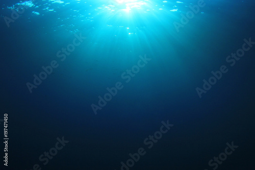 Underwater background. Sunlight on ocean surface