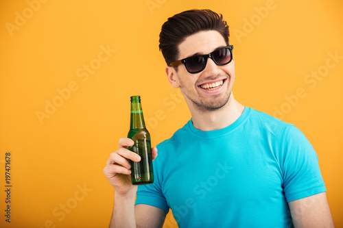 Portrait of a happy young man in sunglasses