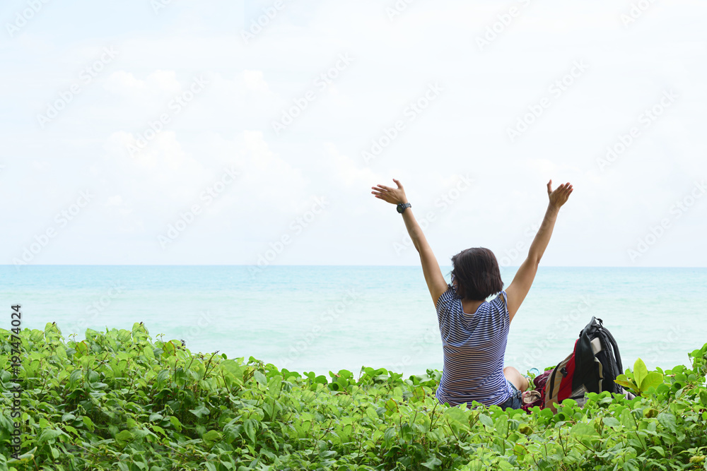 Freedom girl tourists sit on the beach. Freedom girl tourists sit on the beach.