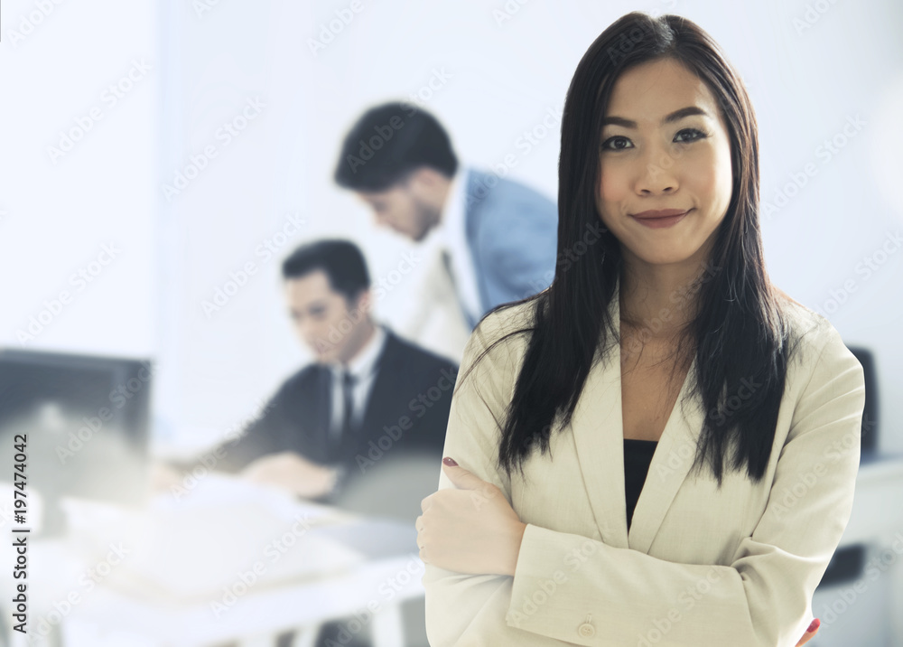 Leader businesswoman executive is standing in front and foreground team working to success for start up project. Leader businesswoman executive is standing in front and foreground team working to success for start up project.