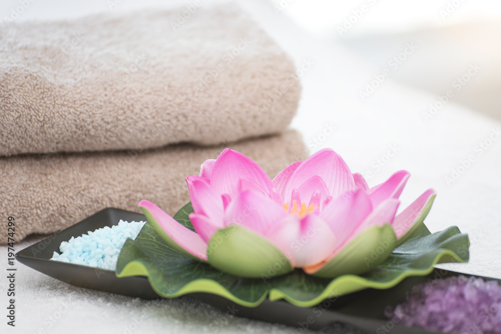 Spa accessories still life with lotus flower, salt and towel. Spa accessories still life with lotus flower, salt and towel.