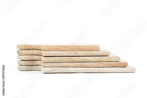 Set of used brown wooden cutting boards stack on each other isolated on white background.