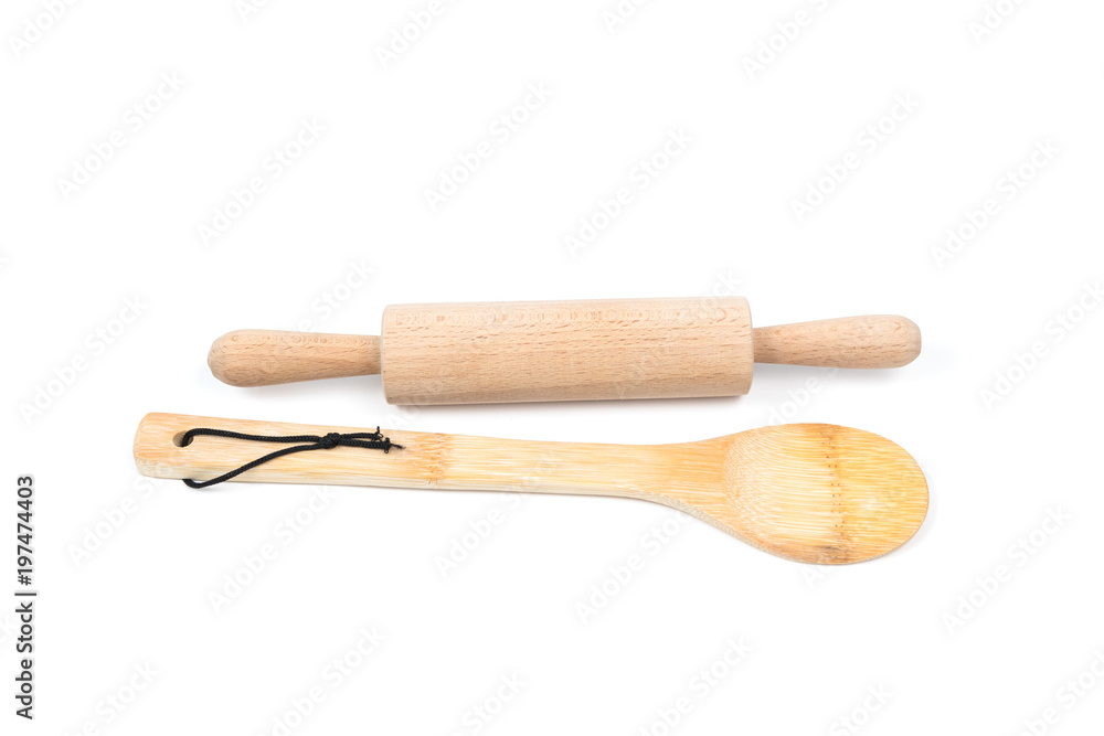Big wooden stirring spoon and small rolling pin isolated on white background. Kitchen and cooking accessory Big wooden stirring spoon and small rolling pin isolated on white background. Kitchen and cooking accessory