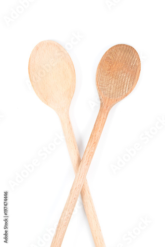 Two long wooden stirring spoons isolated on white background
