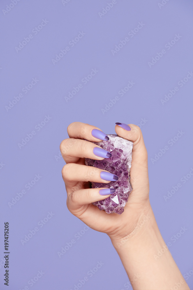 Manicure. Hand With Stylish Nails Holding Purple Gemstone Manicure. Hand With Stylish Nails Holding Purple Gemstone