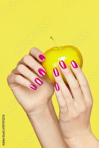 Nails Design. Female Hands With Colorful Nails Holding Apple