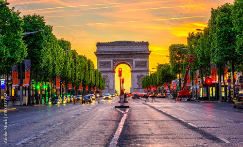 Champs-Elysees and Arc de Triomphe at night in Paris, France photo