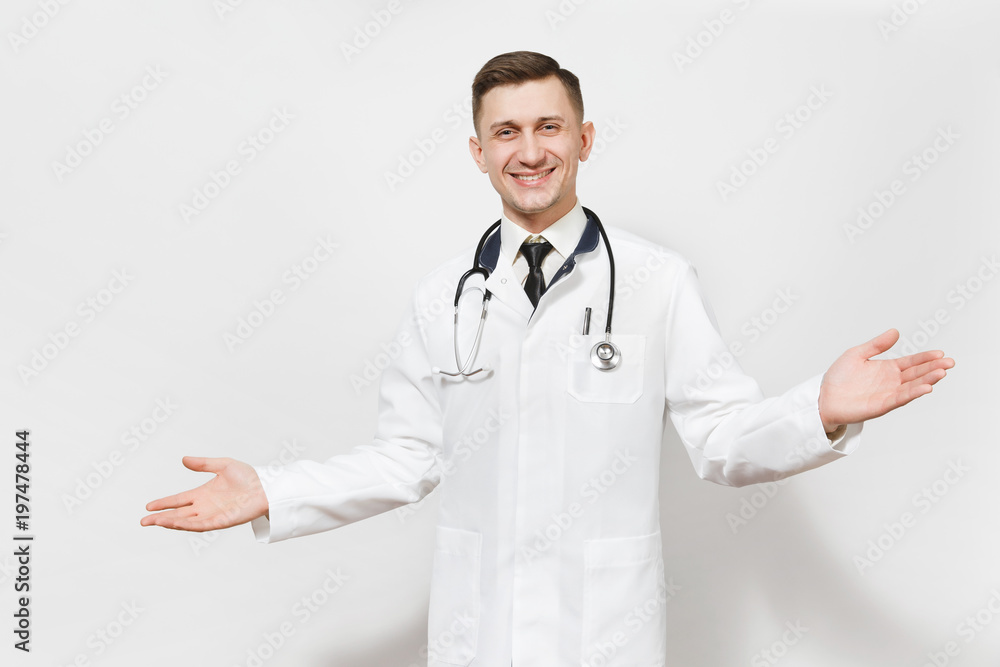 Smiling happy young doctor man isolated on white background. Male doctor in medical gown and stethoscope looking camera, spreading hands for greeting. Healthcare personnel, health, medicine concept. Smiling happy young doctor man isolated on white background. Male doctor in medical gown and stethoscope looking camera, spreading hands for greeting. Healthcare personnel, health, medicine concept.