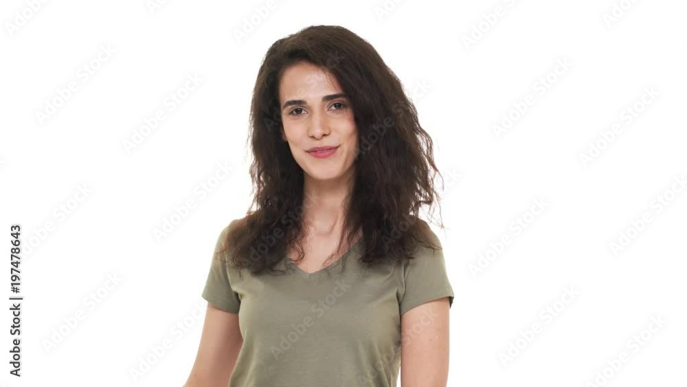 Portrait of cheerful brunette woman pointing finger on camera meaning hey you, isolated on white background. Concept of emotions Portrait of cheerful brunette woman pointing finger on camera meaning hey you, isolated on white background. Concept of emotions