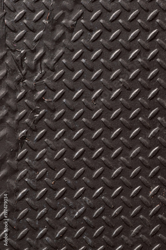Black diamond plate closeup abstract texture background. 