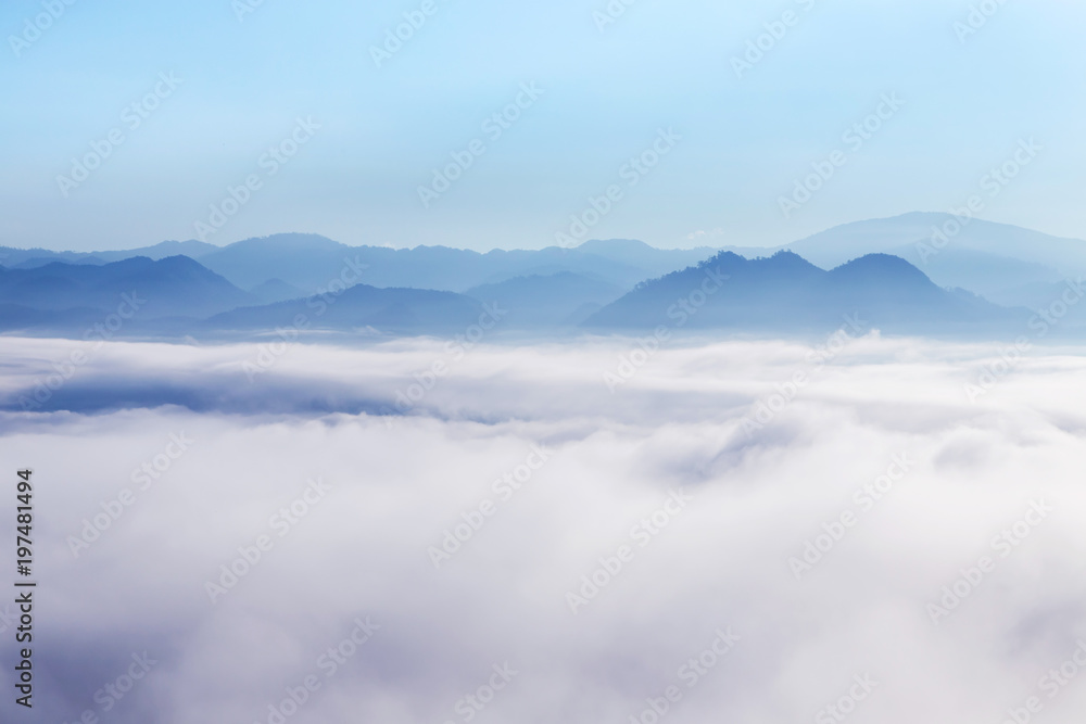landscape view of sunrise on high angle view with white fog in early morning over rainforest mountain in thailand 