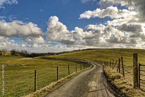An English country lane leading through farmland.