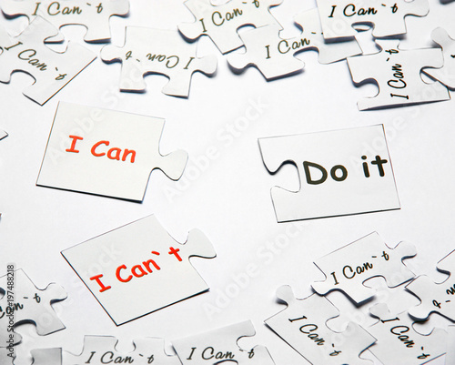 I can or I can`t do it. Words of motivation. Concept motivational message of ability and possibility. I can`t and you can are written on puzzle pieces.