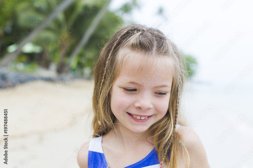 beautiful blond girl on the beach with a blue and white striped dress beautiful blond girl on the beach with a blue and white striped dress