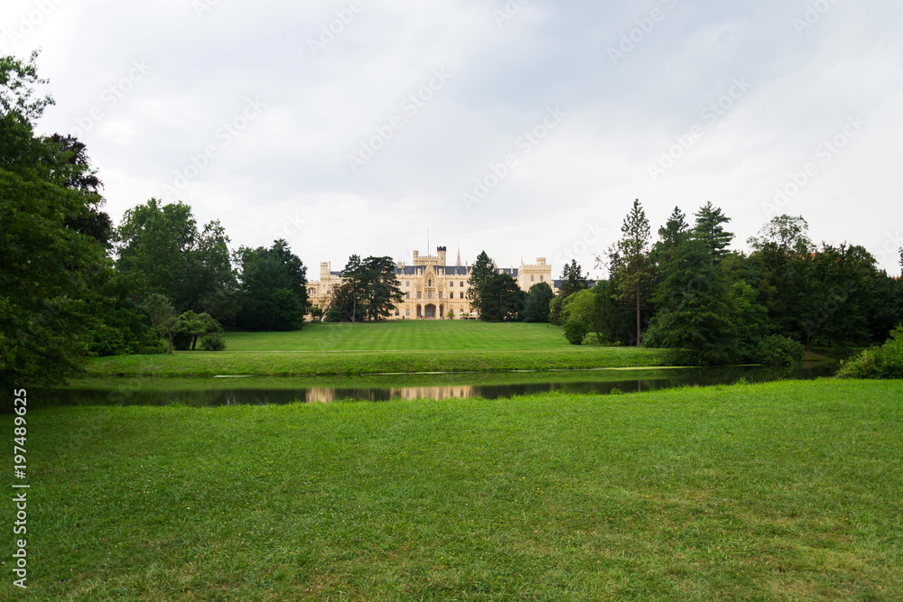 Castle pond with Lednice mansion in Lednice Valtice area, Moravia, Czech Republic, summer day