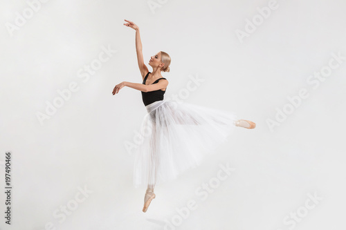 Amazing young woman ballerina dancing