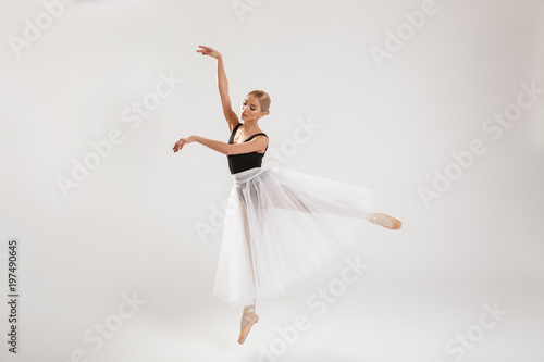 Beautiful young woman ballerina dancing