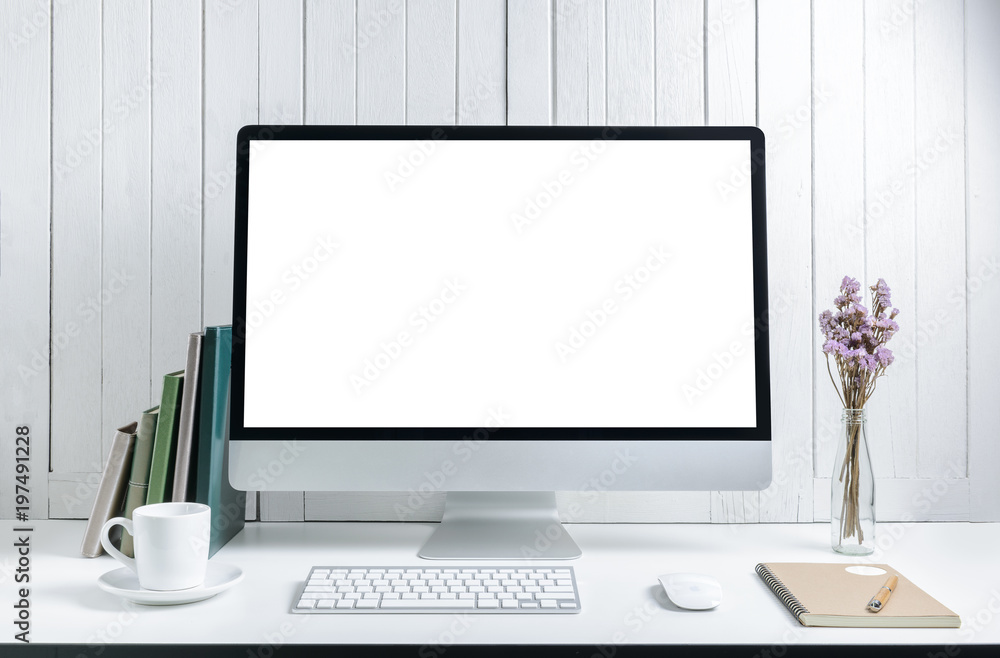 workplace background with Blank white screen modern desktop computer. White wooden vintage blackground workplace background with Blank white screen modern desktop computer. White wooden vintage blackground