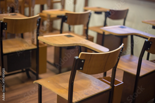 Classic classroom chair with arm bar by nobody in class use for lecture or education