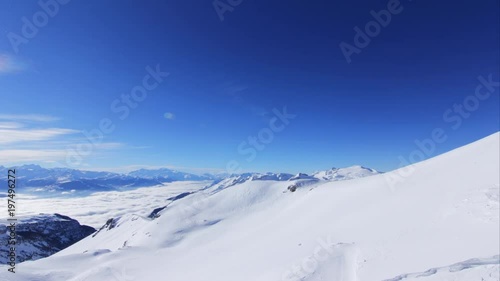 4K Beautiful Mountain Timelapses on a Winter day - Valley with clouds. Breathtaking panorama Time lapse in Crans-Montana, Switzerland - Sunny day, perfect clouds