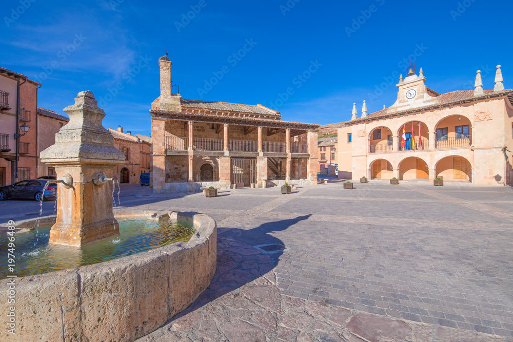 main square with fountain, church of San MIguel (Saint Michael), from twelfth century, and town hall public building, from sixteenth century, in old town of Ayllon village, Segovia, Spain, Europe
