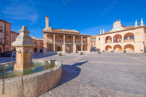 main square with fountain, church of San MIguel (Saint Michael), from twelfth century, and town hall public building, from sixteenth century, in old town of Ayllon village, Segovia, Spain, Europe 