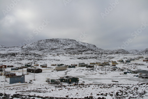 View of Cape Dorset Nunavut with a layer of snow on the ground, a northern Inuit community