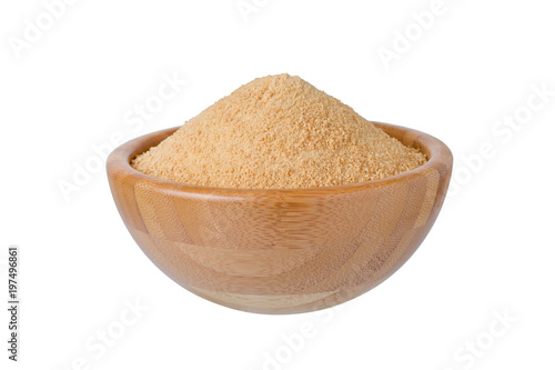 wooden bowl with organic coconut sugar isolated on white