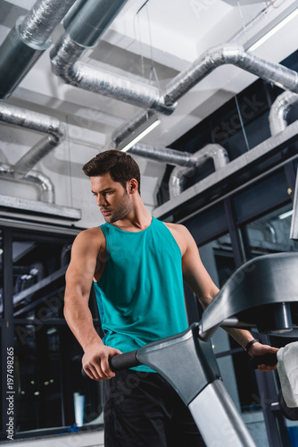 handsome sportsman exercising on treadmill in gym © LIGHTFIELD STUDIOS