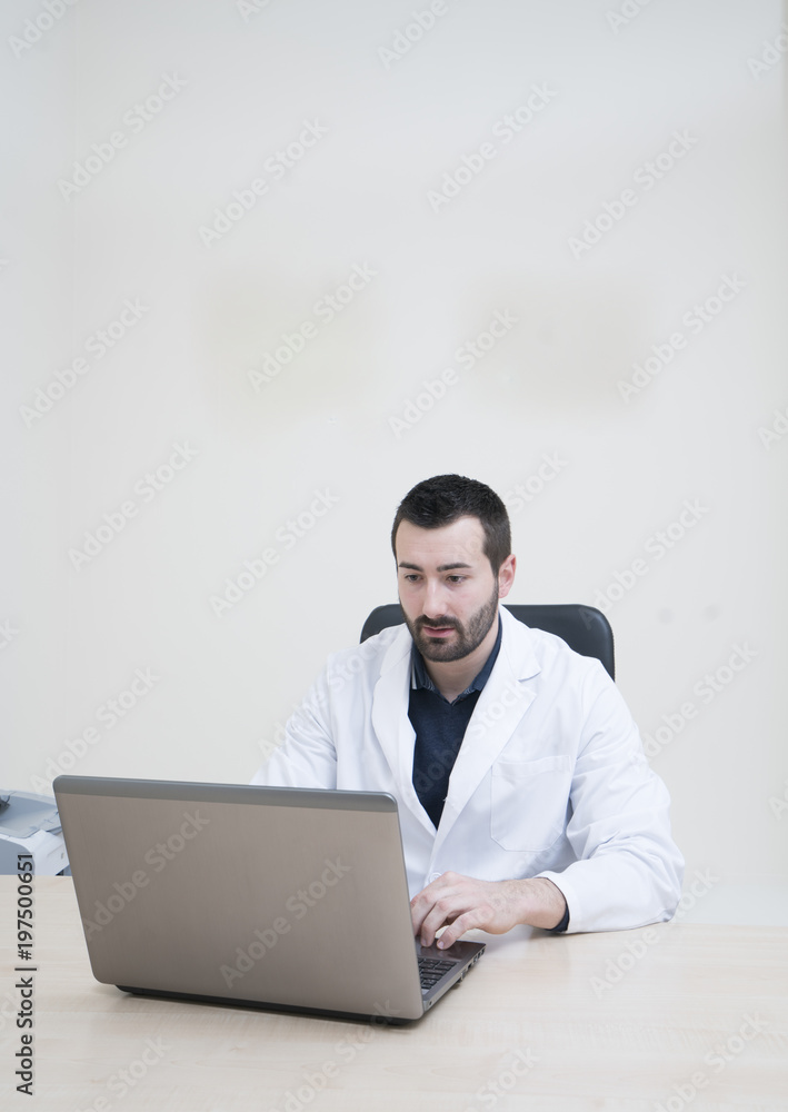 nutritionist with laptop in his clinic nutritionist with laptop in his clinic