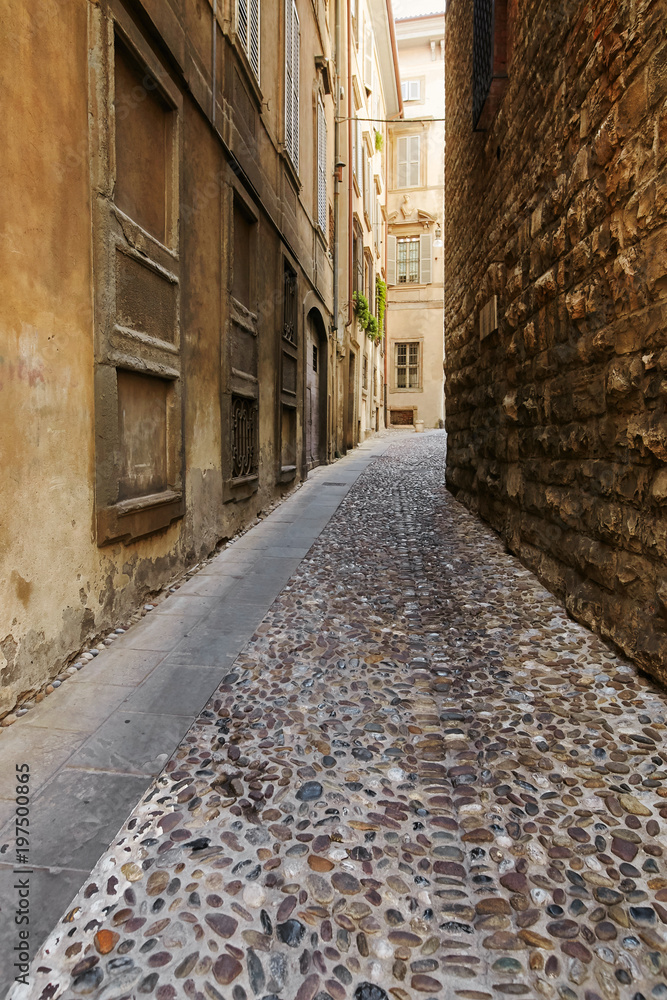 Bergamo, Italy - August 18, 2017: Quiet and narrow streets of the old town of Bergamo.