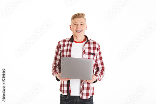 Foto Portrait of smiling smart teenage boy wearing plaid shirt and braces studying us