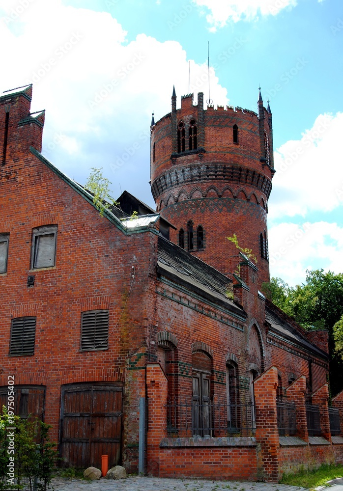 Wismar, State of Mecklenburg-Vorpommern, Germany; neo-gothic watertower and building of the waterworks (1897), built of red brick and ornamental green glazed tiles
