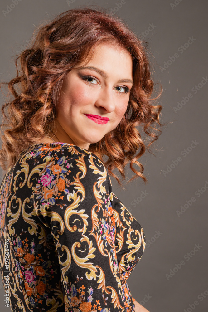 Portrait of an attractive smiling girl on a neutral background Portrait of an attractive smiling girl on a neutral background