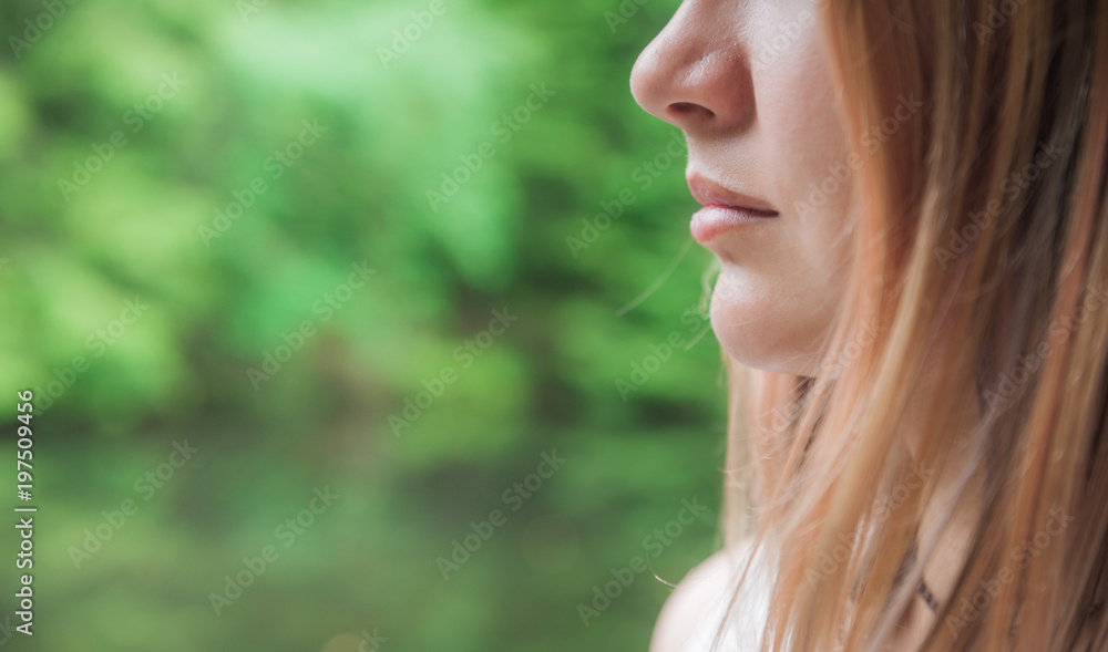 Portrait of beautiful woman on green summer background Portrait of beautiful woman on green summer background