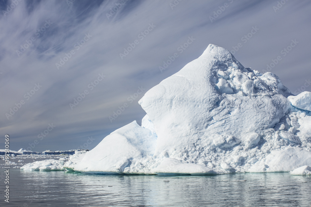 Giant Icebergs of Illulisat, Greenland, floating on water, a popular cruise destination Giant Icebergs of Illulisat, Greenland, floating on water, a popular cruise destination