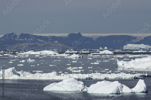 Giant Icebergs of Illulisat, Greenland, floating on water, a popular cruise destination