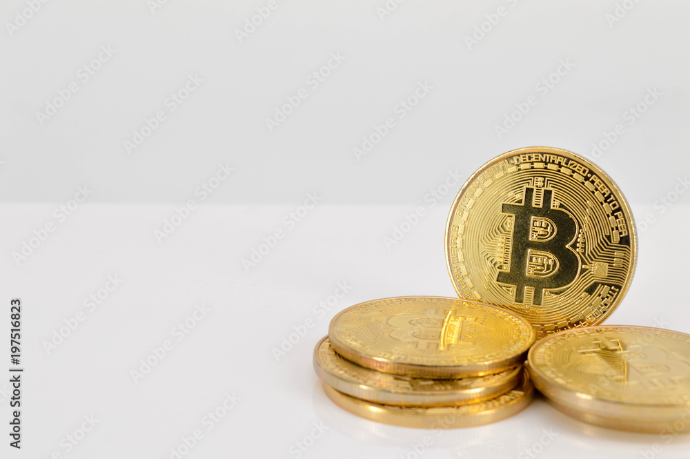 Gold Bitcoins on white background. Selective focus.. Gold Bitcoins on white background. Selective focus..