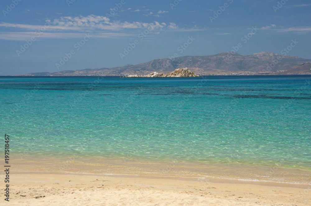 Crystal clear waters of Mikri Vigla beach at Naxos island in Greece Crystal clear waters of Mikri Vigla beach at Naxos island in Greece